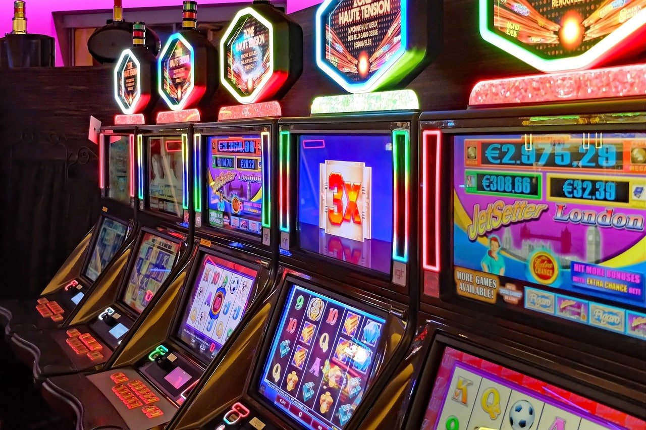 agent okebet mobile app interface showing sports betting and casino games on smartphone